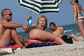 top comes off young teen at beach