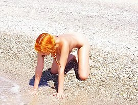 handjob on a nude beach