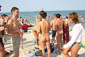 family at the beach world nudism