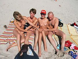 nude sunbathing in the beach and fucking